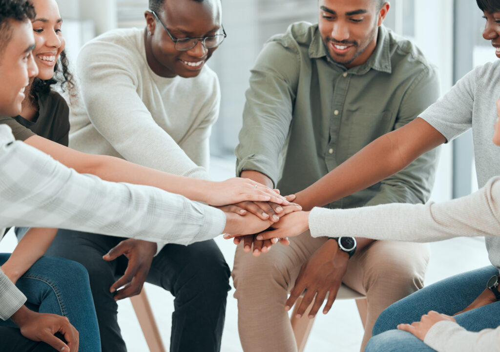 men and women bonding at a group session at a treatment center